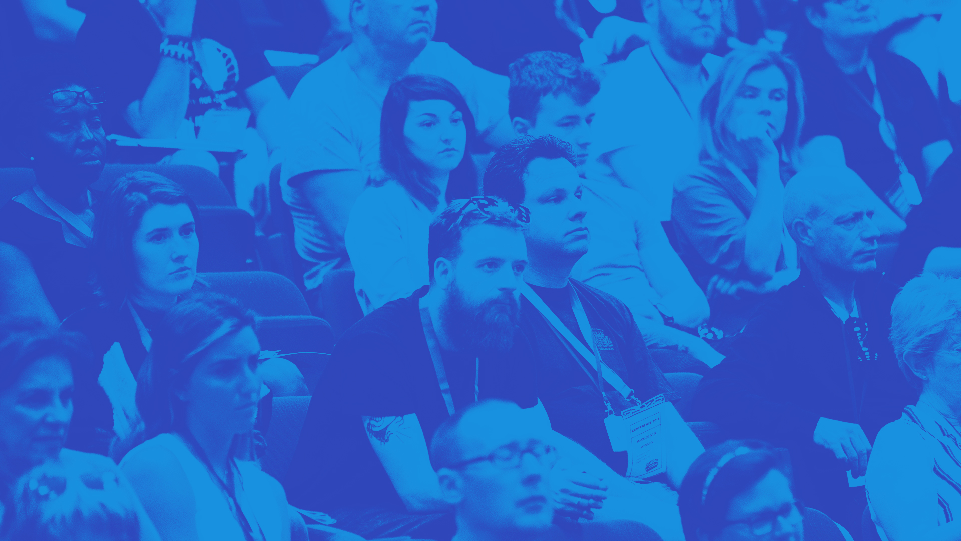 The image shows students attending a lecture.