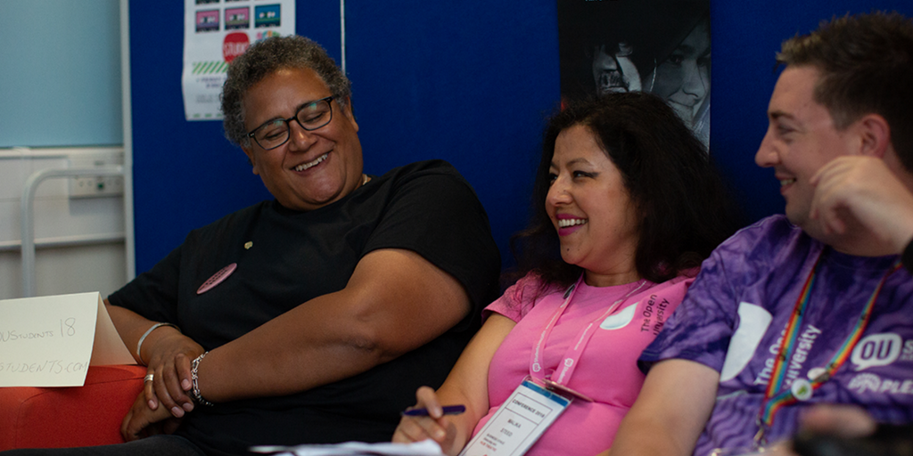 Three students sitting together talking