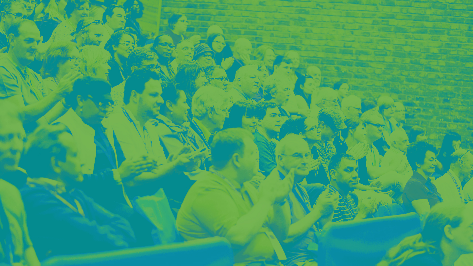 The image shows students attending a lecture.