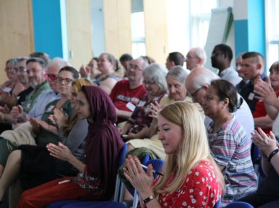 An image of OU students gathered together for a seminar