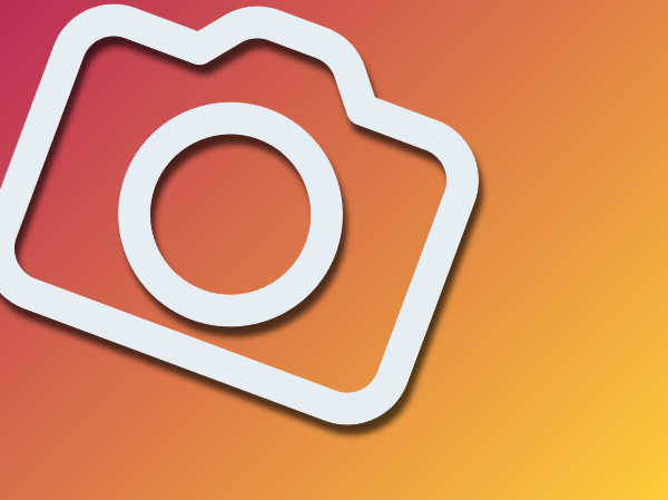 Gradient peach coloured background with a large white icon of a camera.