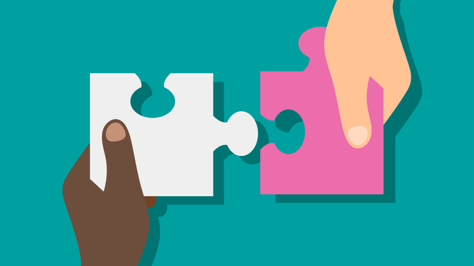 Two hands holding puzzle pieces that fit together.
